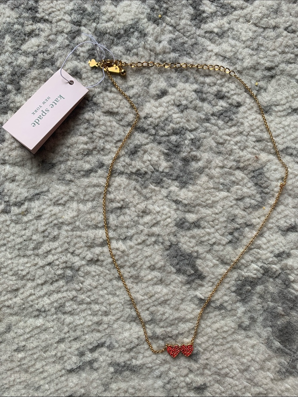 Kate Spade “Yours Truly” gold-tone necklace with red double heart charms